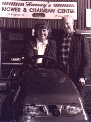 Harvey and Norma Oliver with one of their ride-on mowers.